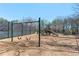 Community playground with swings and slides on a mulch surface, surrounded by trees at 2140 Azalea Dr, Roswell, GA 30075