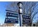 An inviting street sign directs you to parking, the library, Canton Street Shops, and the historic Smith Plantation at 2140 Azalea Dr, Roswell, GA 30075