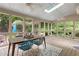 Charming sunroom with wood floors, skylights, and views of the lush surrounding greenery at 2140 Azalea Dr, Roswell, GA 30075