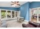 Blue sunroom with an abundance of windows and access to both interior and exterior spaces at 2140 Azalea Dr, Roswell, GA 30075