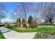 Town square with flags, mature trees, and benches offering residents a lovely area to enjoy at 2140 Azalea Dr, Roswell, GA 30075