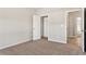 Bedroom featuring neutral walls, carpet, and a closet for ample storage at 498 Charleston Pl, Villa Rica, GA 30180