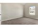 Bedroom featuring neutral walls, carpet, and a window showcasing an exterior view at 498 Charleston Pl, Villa Rica, GA 30180