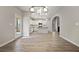 Inviting dining room with bright light fixture, view of the kitchen, and doorway to living room at 498 Charleston Pl, Villa Rica, GA 30180
