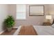 Well-lit bedroom showcasing a relaxing ambiance with a plant and stylish lamp at 67 Jennifer Ln, Rydal, GA 30171
