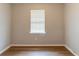 A neutral bedroom featuring a small window at 67 Jennifer Ln, Rydal, GA 30171