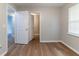 Bedroom with modern floors, neutral color, and view into other rooms at 67 Jennifer Ln, Rydal, GA 30171