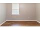 Bright bedroom with wood-look flooring and a window at 67 Jennifer Ln, Rydal, GA 30171