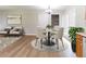 Charming dining area featuring a round table, white chairs, and natural light from the exterior at 67 Jennifer Ln, Rydal, GA 30171