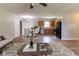 Open living room featuring hardwood floors, a ceiling fan, and a dining area near the kitchen at 67 Jennifer Ln, Rydal, GA 30171