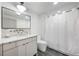 Bright bathroom featuring a modern vanity with a marble countertop and a sleek, black-framed mirror at 726 Edgewood Ne Ave, Atlanta, GA 30307
