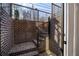 Brick walkway with black metal railing and brick walls lead to a lower level entry at 726 Edgewood Ne Ave, Atlanta, GA 30307