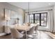 Modern dining room with textured walls, stylish light fixture and expansive view at 726 Edgewood Ne Ave, Atlanta, GA 30307