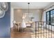 Elegant dining room with hardwood floors, designer lighting, and a large window at 726 Edgewood Ne Ave, Atlanta, GA 30307