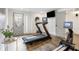 Exercise room featuring a treadmill, rowing machine, and TV, creating a great workout space at 726 Edgewood Ne Ave, Atlanta, GA 30307