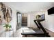 This exercise room features a treadmill, a stylish painting, and an inviting entryway to the outside at 726 Edgewood Ne Ave, Atlanta, GA 30307