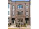 Brick townhome showcases symmetrical design with dual entryways and manicured landscaping at 726 Edgewood Ne Ave, Atlanta, GA 30307