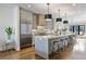 Spacious kitchen features stainless steel appliances, a large island, and ample cabinet space at 726 Edgewood Ne Ave, Atlanta, GA 30307