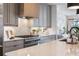 Modern kitchen features updated appliances, a central island, and seamless countertops at 726 Edgewood Ne Ave, Atlanta, GA 30307