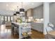 Bright, open kitchen with gray cabinetry, large island, and pendant lighting at 726 Edgewood Ne Ave, Atlanta, GA 30307