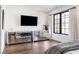 Spacious primary bedroom featuring mirrored dressers, hardwood floors, and natural light at 726 Edgewood Ne Ave, Atlanta, GA 30307