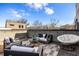 Comfortable rooftop patio featuring lounge furniture, a cozy egg chair, and overhead string lights for a relaxed setting at 726 Edgewood Ne Ave, Atlanta, GA 30307
