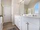 Bathroom featuring double vanity, white cabinets, and a separate shower and soaking tub at 113 Glenmore Ln, Mcdonough, GA 30253