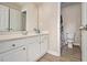 Bathroom with double door access and a view of the toilet and sink at 113 Glenmore Ln, Mcdonough, GA 30253