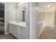 Bathroom with stairs in view, showing a long sink and storage at 113 Glenmore Ln, Mcdonough, GA 30253