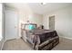 Bedroom with a large window that provides natural light and wood furniture at 113 Glenmore Ln, Mcdonough, GA 30253