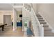 Spacious foyer featuring stairs and an open view of the living area, filled with natural light at 113 Glenmore Ln, Mcdonough, GA 30253