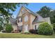 Attractive home with a mix of stone and stucco facade, complemented by a well-kept lawn and garden at 113 Glenmore Ln, Mcdonough, GA 30253