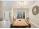Game room with a pool table, high ceilings, large windows, and modern decor, perfect for entertainment at 113 Glenmore Ln, Mcdonough, GA 30253