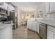 Bright eat-in kitchen with stainless steel appliances and white cabinetry overlooking breakfast nook at 113 Glenmore Ln, Mcdonough, GA 30253