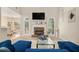 Bright living room with fireplace, vaulted ceilings, and view of the backyard at 113 Glenmore Ln, Mcdonough, GA 30253