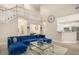 Open living room with vaulted ceilings and view of game room and kitchen at 113 Glenmore Ln, Mcdonough, GA 30253