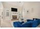 Bright living room with fireplace, high ceilings, and backyard access at 113 Glenmore Ln, Mcdonough, GA 30253
