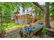 Relaxing backyard retreat with a swing, a deck, and lush greenery at 1703 Brandywine Ct, Atlanta, GA 30338