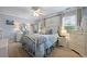 Charming bedroom with blue walls, white trim, and a cozy queen-sized bed at 1703 Brandywine Ct, Atlanta, GA 30338