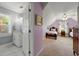 Cozy bedroom with lilac walls and two beds, plus a private bathroom with a sink at 1703 Brandywine Ct, Atlanta, GA 30338