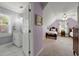 Upstairs bedroom featuring a small ensuite and carpet flooring at 1703 Brandywine Ct, Atlanta, GA 30338