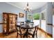 Cozy breakfast nook with a bay window and built-in bar next to the kitchen at 1703 Brandywine Ct, Atlanta, GA 30338