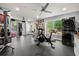 Spacious home gym featuring exercise equipment and a washer/dryer combo at 1703 Brandywine Ct, Atlanta, GA 30338