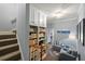 Hallway leading to a cozy sitting area with bookshelves and plush blue armchairs at 1703 Brandywine Ct, Atlanta, GA 30338