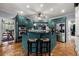 Updated kitchen features stainless appliances, a tile backsplash, and a peninsula island with bar seating at 1703 Brandywine Ct, Atlanta, GA 30338