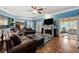 Elegant living room with hardwood floors, a fireplace, and custom millwork at 1703 Brandywine Ct, Atlanta, GA 30338
