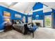 Bright main bedroom with vaulted ceilings, fireplace, and large windows overlooking the yard at 1703 Brandywine Ct, Atlanta, GA 30338