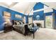 Bright main bedroom with cathedral ceilings, fireplace, sitting bench, and plenty of natural light at 1703 Brandywine Ct, Atlanta, GA 30338