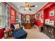 Comfortable home office with custom built-in bookshelves, desk, and comfortable seating area at 1703 Brandywine Ct, Atlanta, GA 30338
