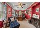 Home office space features built-in bookcases, a ceiling fan, and a comfortable reading nook at 1703 Brandywine Ct, Atlanta, GA 30338